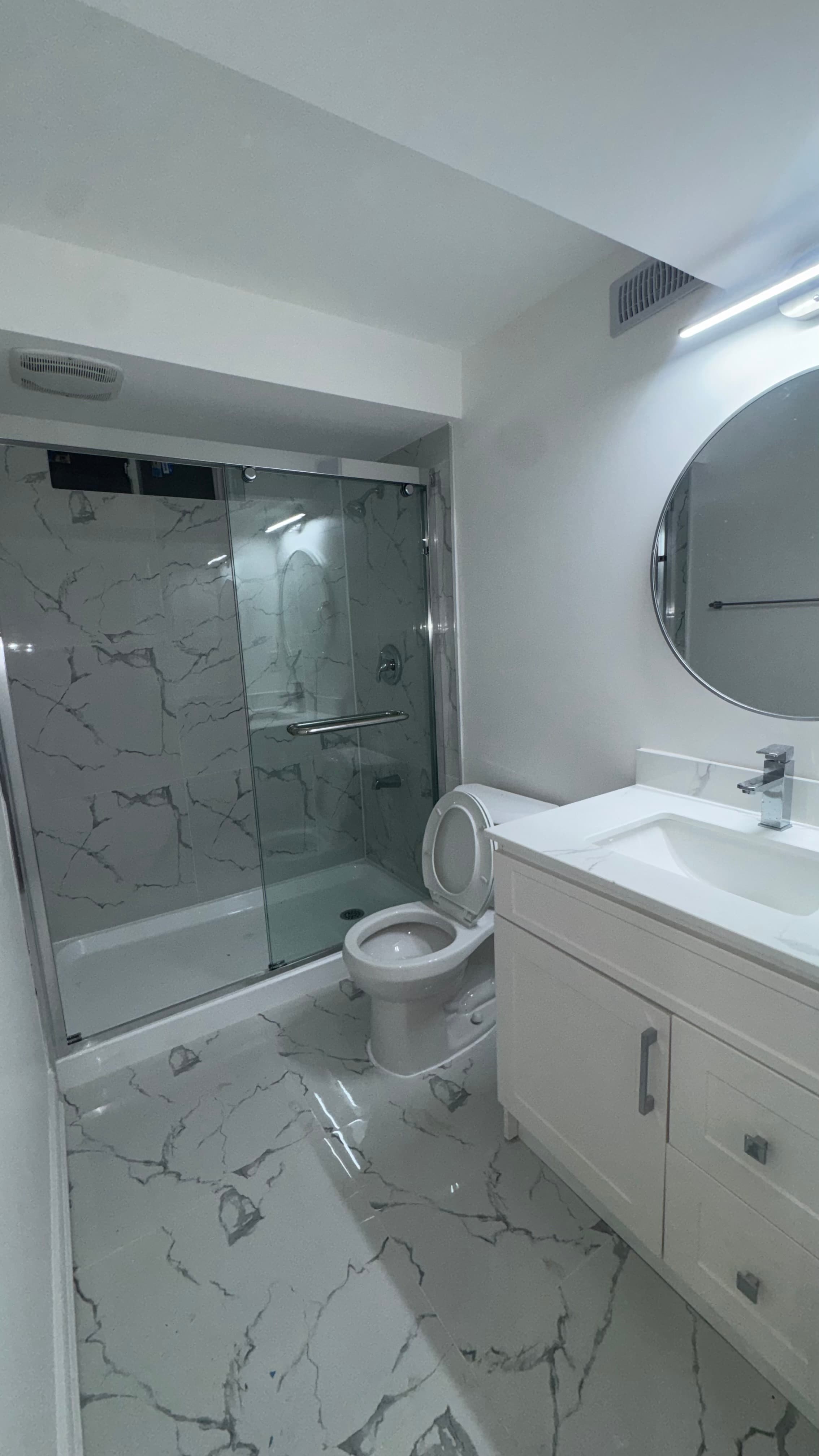 Modern washroom renovation by League Construction